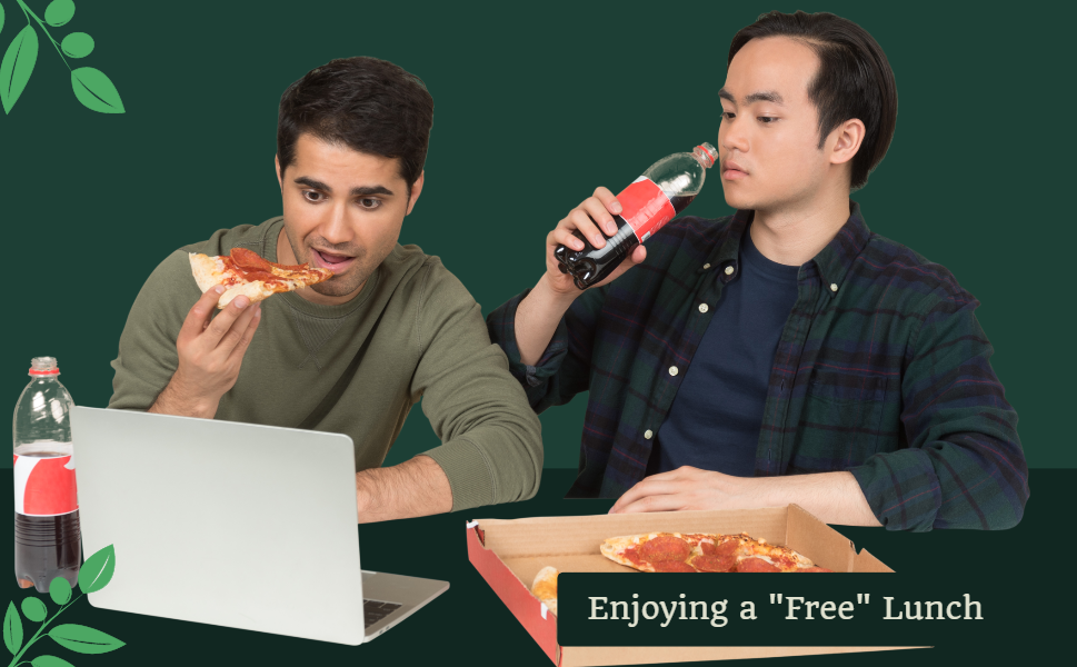 two men looking at a laptop screen eating pizza and drinking softdrinks 